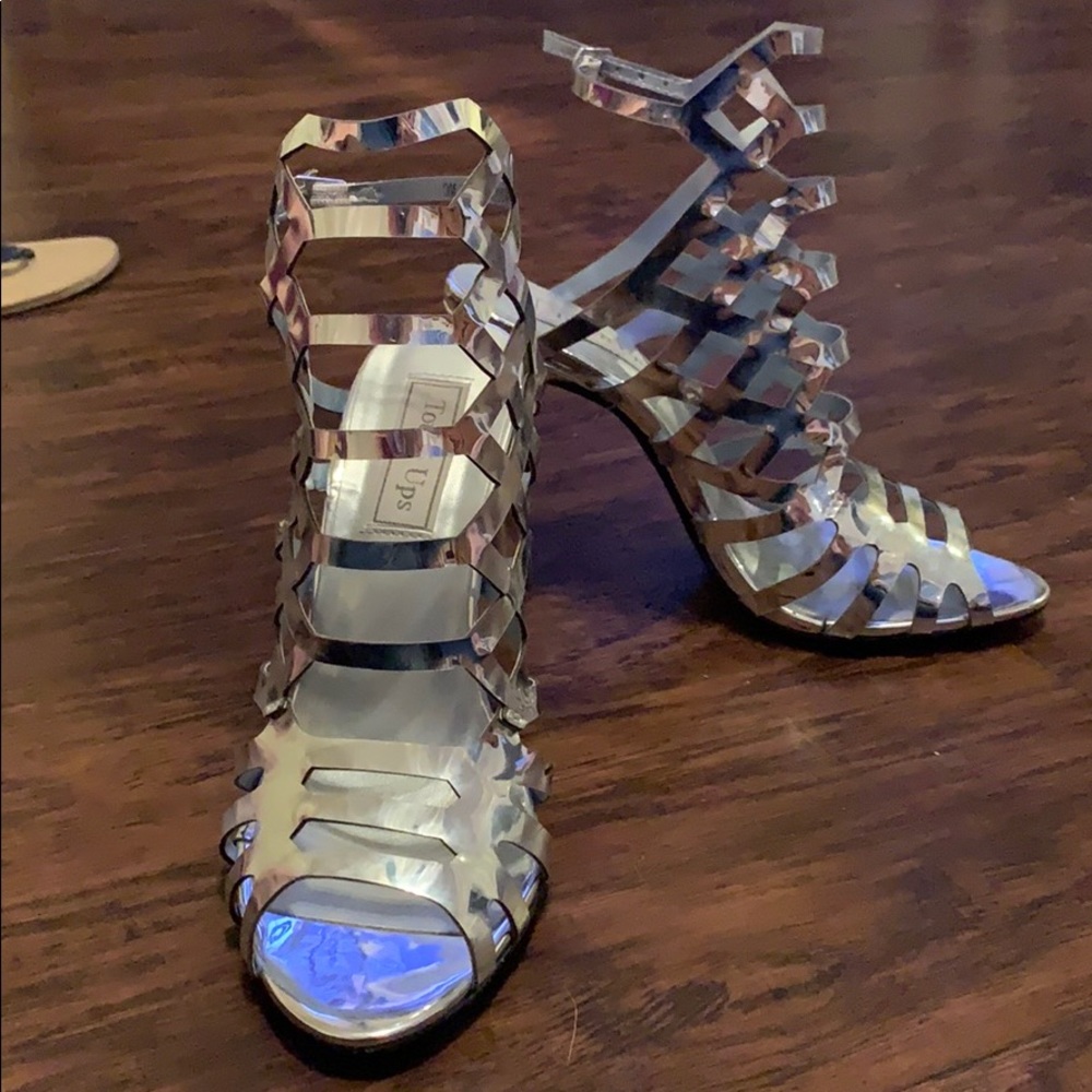 Touch Ups silver stilettos w/ geometric shape